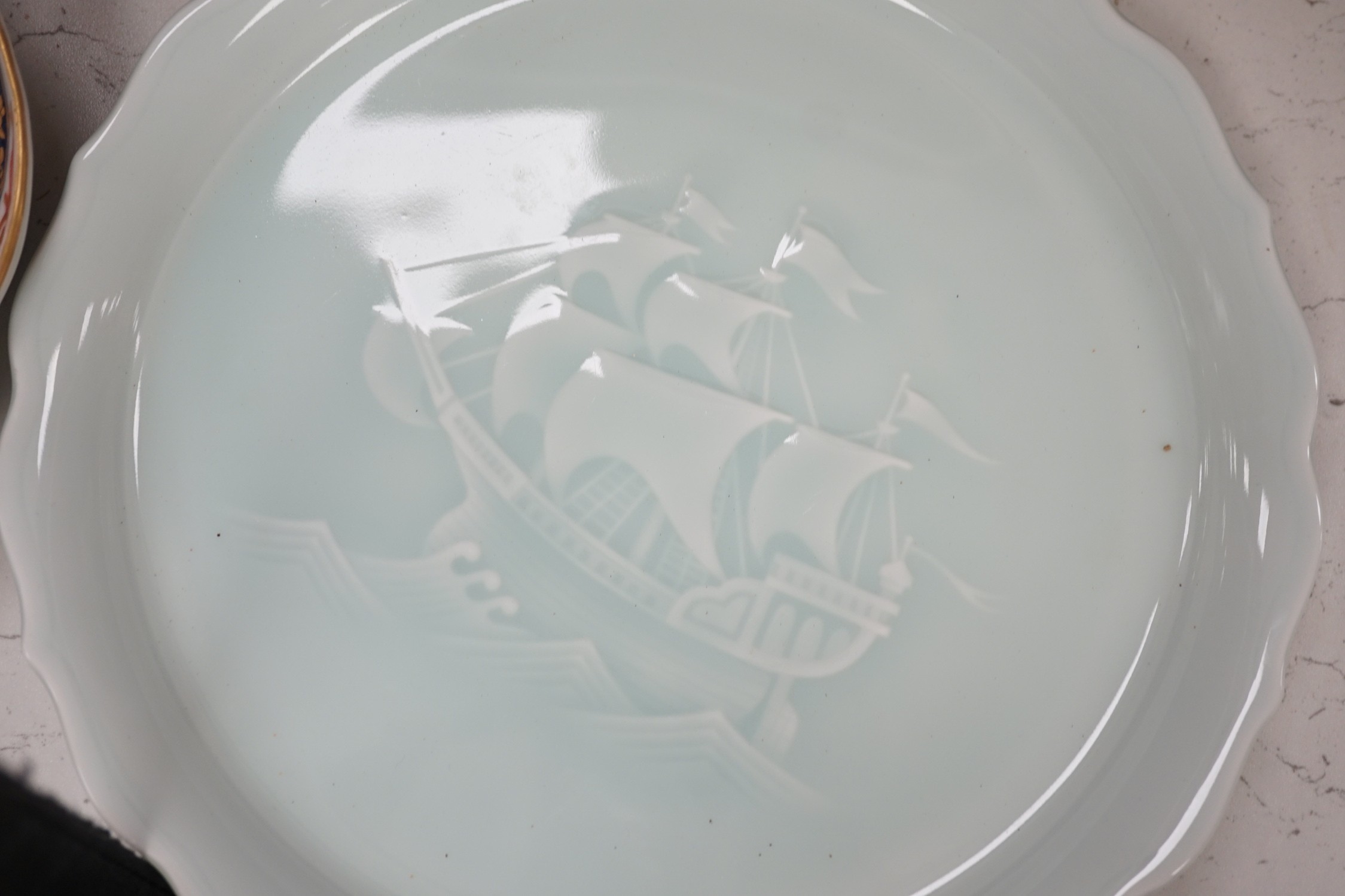 A group of 19th/20th century Japanese porcelain and pottery dishes. Largest 33cm diameter